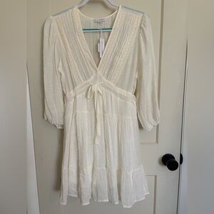 Baltic Born Cream Sundress with Plunge Neckline Long Sleeve and Ruffled Skirt